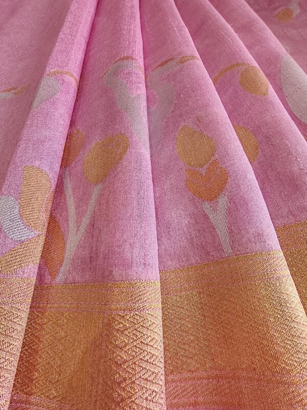 Fabric shot of Pastel pink matka silk jamdani saree flamingo motifs