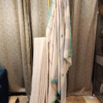 off white cotton saree with turquoise border handloom