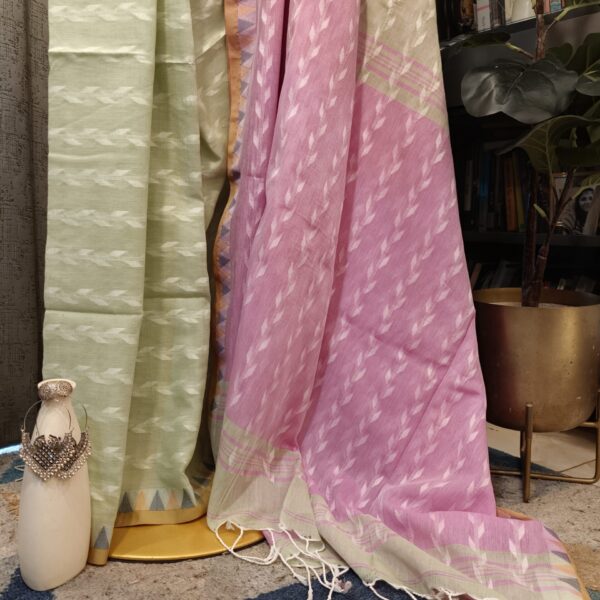 green pink saree close-up handloom weave texture