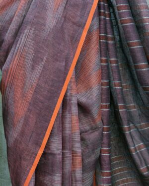close-up of deep plum linen saree texture and stripes