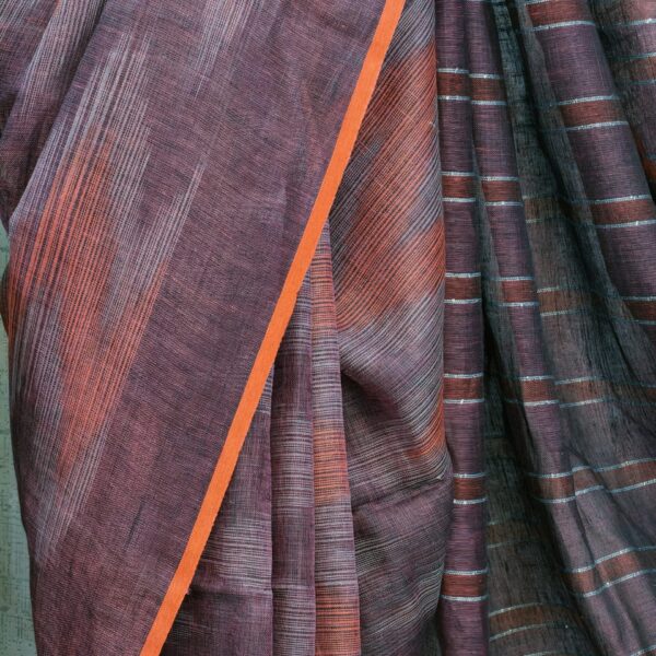 close-up of deep plum linen saree texture and stripes